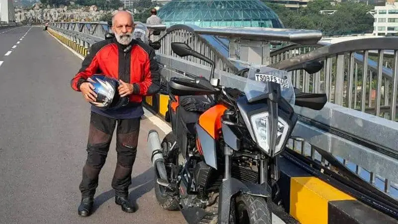 Men Holding Motorcycle Helmet