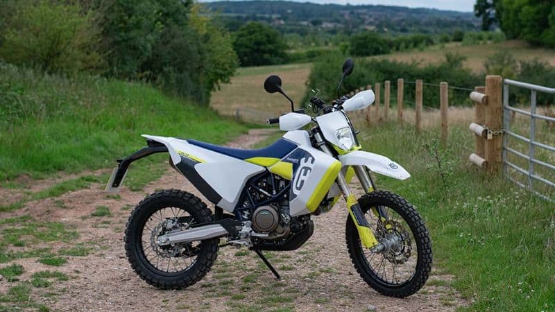 Husqvarna 701 Enduro LR on Sidestand with Mountains in Background