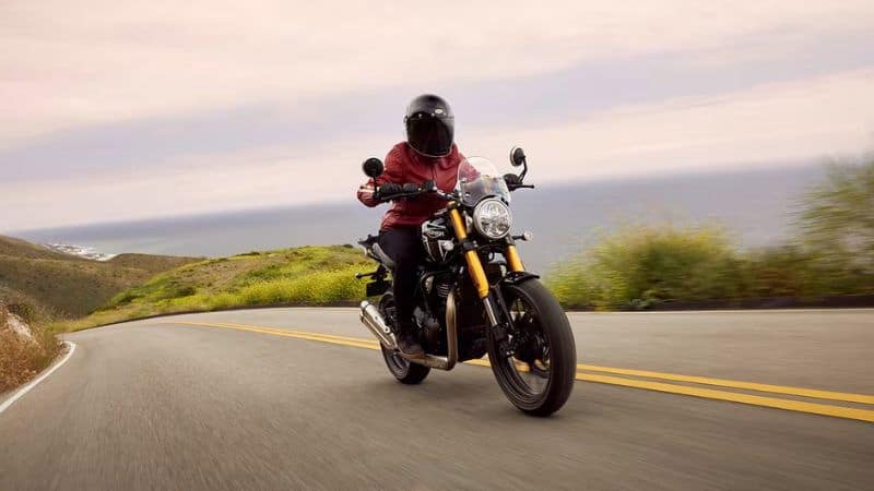 Man Riding Motorcycle on Highway at High Speed