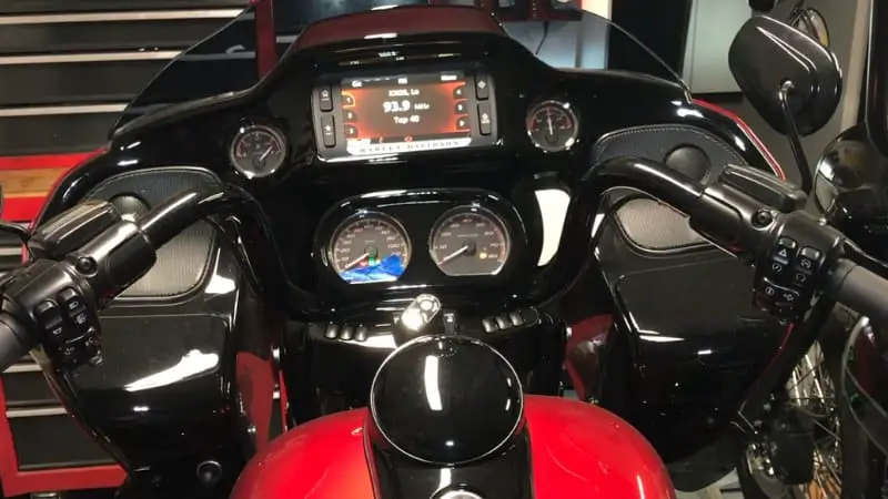 Close-up view of a Harley-Davidson motorcycle dashboard with digital displays and chrome detailing